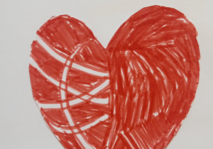 Laurka wykonana przez ucznia uczęszczającego do świetlicy. Przedstawia czerwone serce na białym tle.