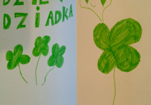 Laurka wykonana prze ucznia uczęszczającego do świetlicy. Przedstawia liście zielonej czterolistnej koniczyny; u góry znajduje się napis: „Dzień Dziadka".